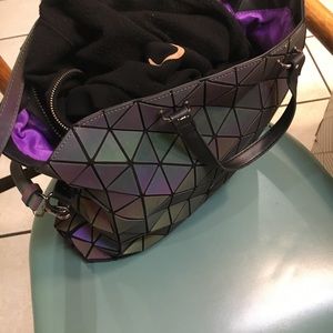 These are Original LUXE hologram bags.. I have newer clutch bag with tag..